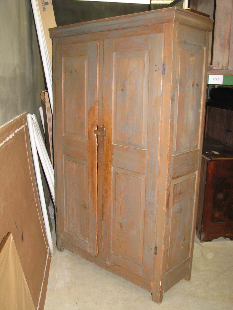 a%20kitchen%20cupboard%20with%20two%20doors%20made%20out%20of%20pine